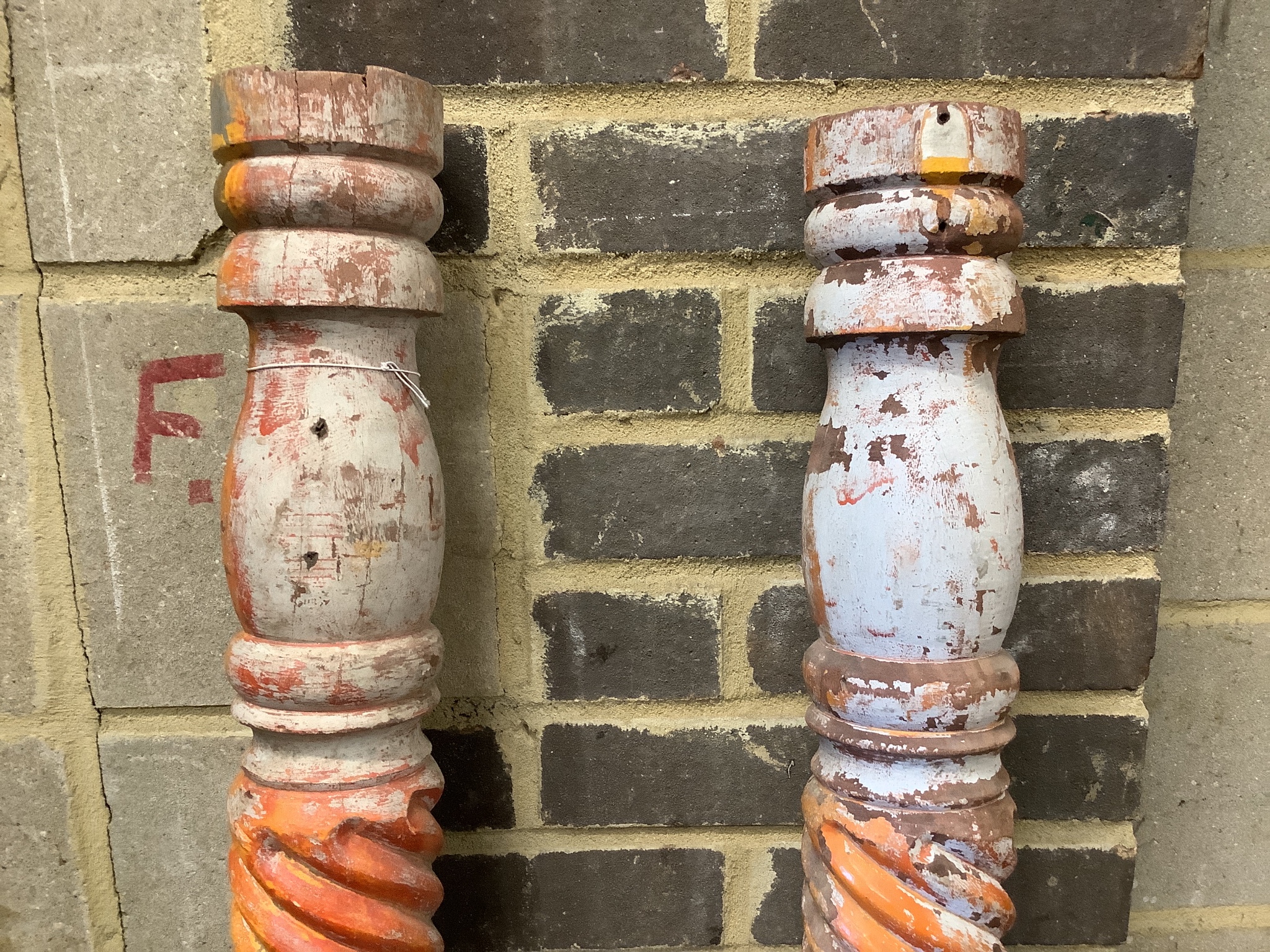 A pair of painted spiral carved wood columns, height 168cm